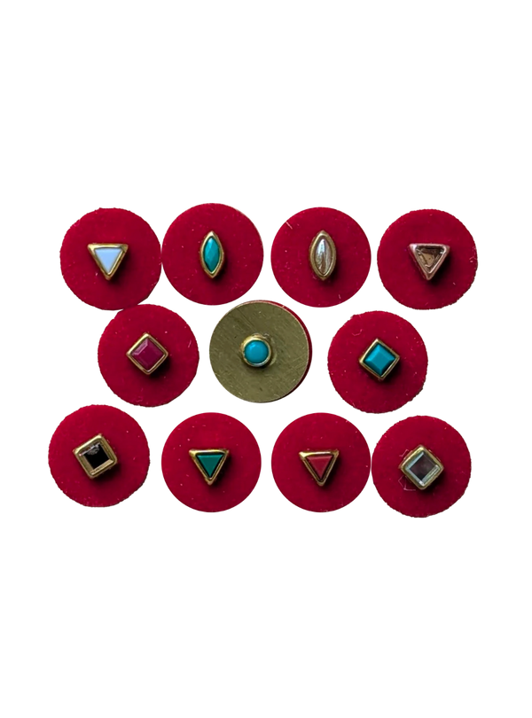 Set of eleven red circular 14mm bindis with various geometric gold and jewel-toned embellishments.
